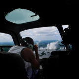 Wildlife photographer Clement Kiragu photographing the Zambias Victoria falls from a helicopter