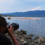 ClementWild tour leader demonstrates how to photograph flamingos in Kenya on his annual bird migration photo safari